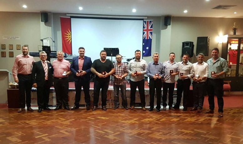 Representatives from participating clubs receiving their plaques