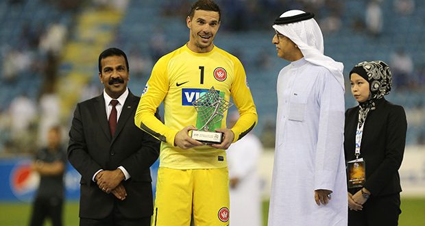 RIYADH, SAUDI ARABIA- NOVEMBER 1: Australia's Western Sydney Wanderers goalkeeper Ante Covic receives the fair player trophy after winning the second leg of the AFC Champions League 2014 football final with a 0-0 draw against Saudi Arabia's Al Hilal at the King Fahd stadium in Riyadh, on November 1, 2014. (Photo by Salah Malkawi/ Getty Images)